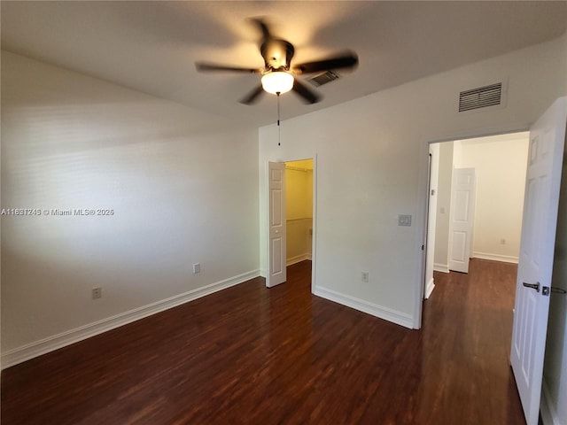 7633 NW 114th Path Unit 7633, Doral, FL 33178 - unfurnished bedroom with dark wood-style flooring, a spacious closet, ceiling fan, and a closet