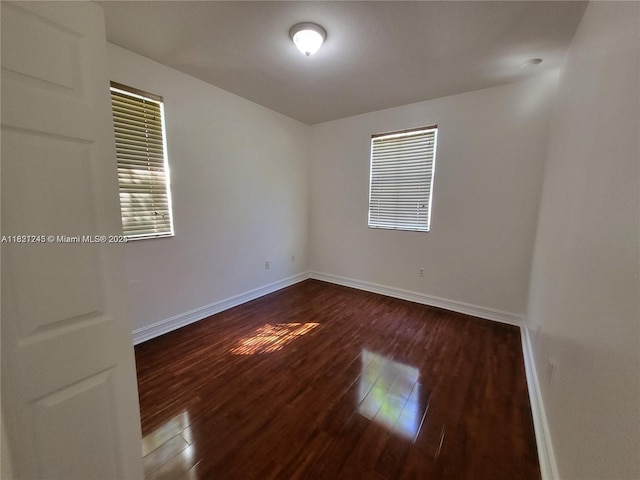 7633 NW 114th Path Unit 7633, Doral, FL 33178 - unfurnished room with dark wood-style floors and baseboards