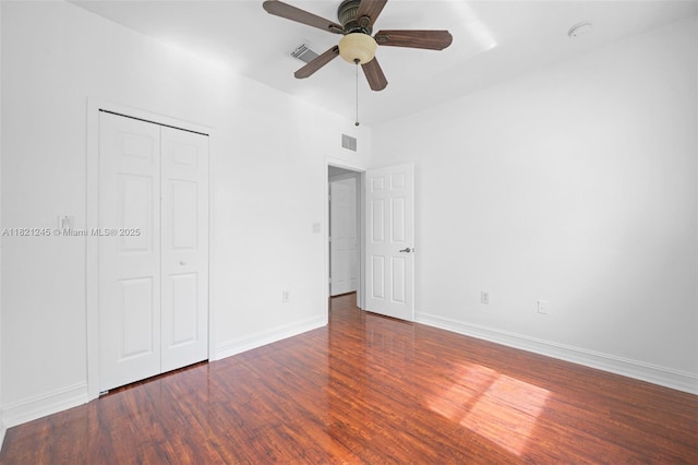 7633 NW 114th Path Unit 7633, Doral, FL 33178 - unfurnished bedroom featuring wood finished floors, a closet, and a ceiling fan