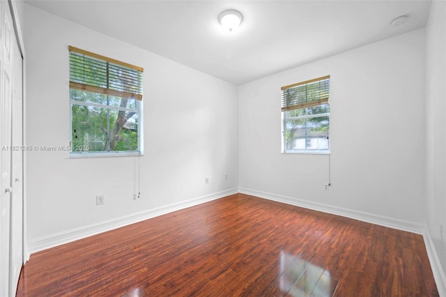 7633 NW 114th Path Unit 7633, Doral, FL 33178 - unfurnished room featuring dark wood finished floors and a smoke detector