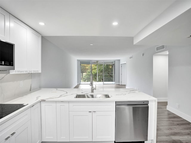 605 Oaks Dr Unit 309, Pompano Beach, FL 33069 - kitchen featuring stainless steel appliances, light stone counters, white cabinetry, and recessed lighting
