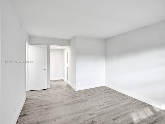 605 Oaks Dr Unit 309, Pompano Beach, FL 33069 - unfurnished room featuring baseboards and wood finished floors