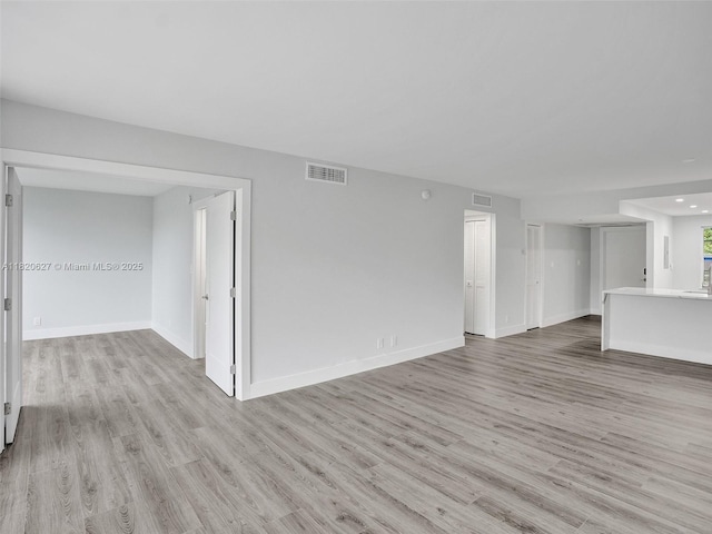 605 Oaks Dr Unit 309, Pompano Beach, FL 33069 - unfurnished living room featuring light wood-type flooring and recessed lighting