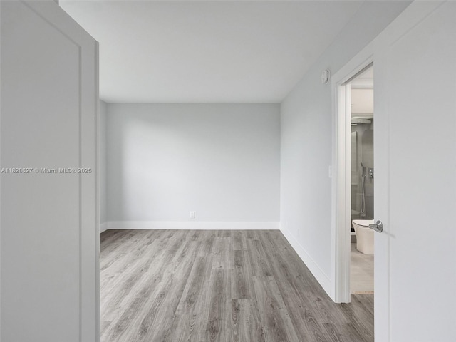 605 Oaks Dr Unit 309, Pompano Beach, FL 33069 - empty room featuring wood finished floors and baseboards