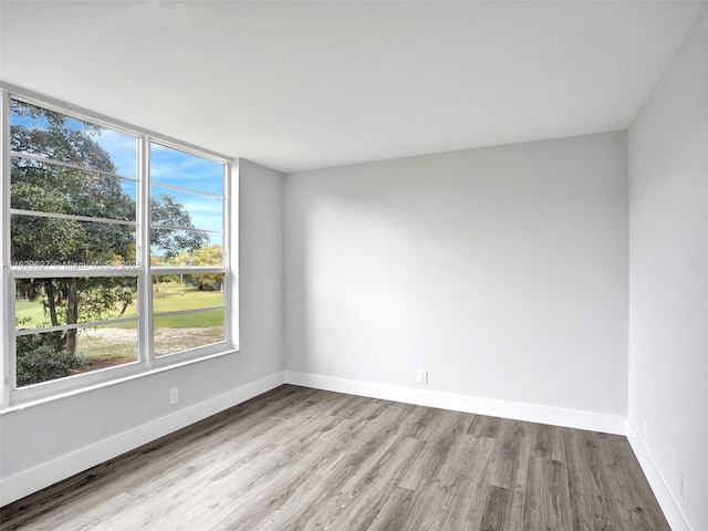 605 Oaks Dr Unit 309, Pompano Beach, FL 33069 - empty room with wood finished floors and baseboards