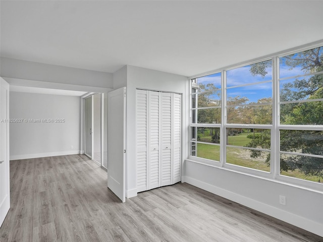 605 Oaks Dr Unit 309, Pompano Beach, FL 33069 - unfurnished bedroom featuring light wood finished floors and a closet