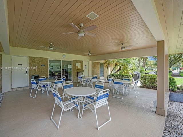 605 Oaks Dr Unit 309, Pompano Beach, FL 33069 - view of patio / terrace featuring outdoor dining area and ceiling fan