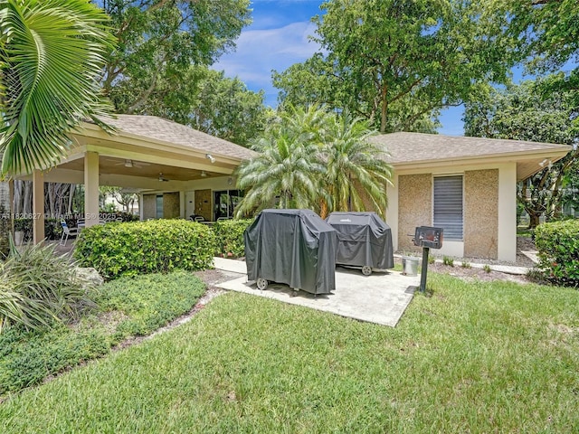 605 Oaks Dr Unit 309, Pompano Beach, FL 33069 - view of grassy yard with ceiling fan and a patio