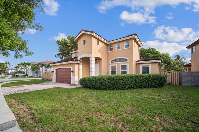 16313 SW 66th St, Miami, FL 33193 - view of front facade featuring driveway, a tiled roof, stucco siding, and a garage