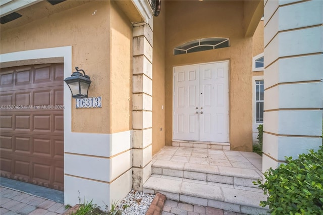 16313 SW 66th St, Miami, FL 33193 - property entrance featuring stucco siding and a garage