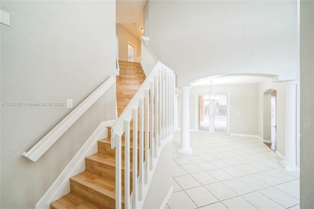 16313 SW 66th St, Miami, FL 33193 - stairs featuring arched walkways, tile patterned floors, a high ceiling, and a chandelier