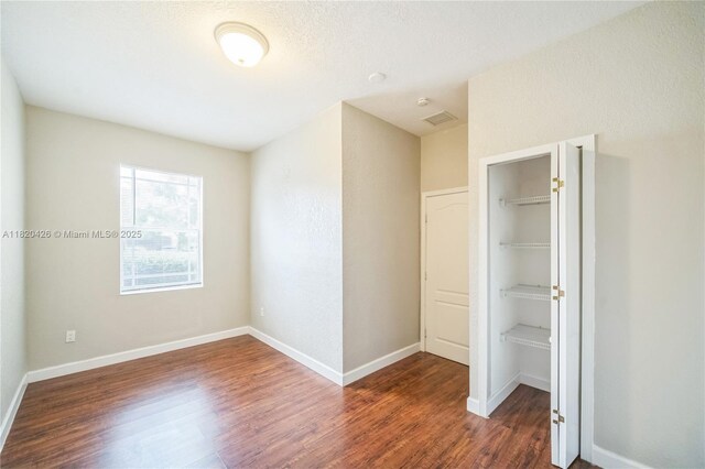 16313 SW 66th St, Miami, FL 33193 - unfurnished bedroom featuring wood finished floors, a closet, and a walk in closet