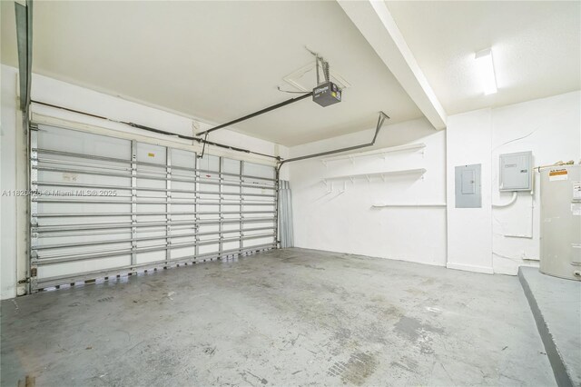 16313 SW 66th St, Miami, FL 33193 - garage with electric panel, a garage door opener, and water heater