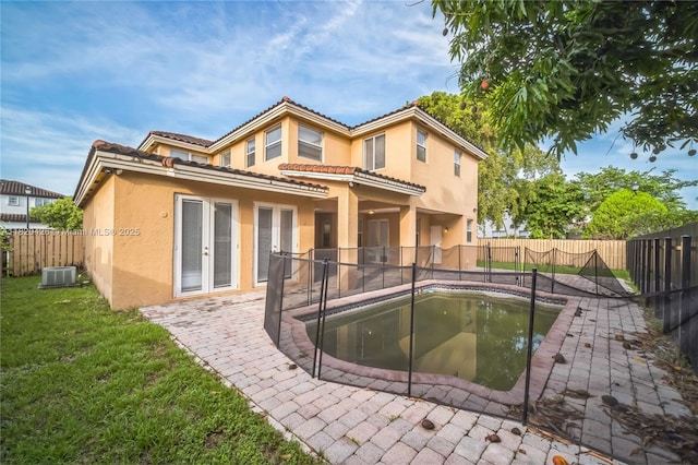 16313 SW 66th St, Miami, FL 33193 - back of house featuring a fenced backyard, stucco siding, a patio area, and a tile roof