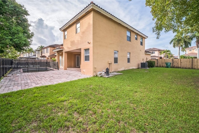 16313 SW 66th St, Miami, FL 33193 - back of property with stucco siding, a fenced backyard, and a patio