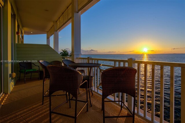 104000 Overseas Hwy Unit 5, Key Largo, FL 33037 - balcony at dusk featuring a water view