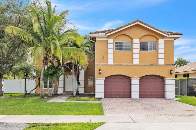 18043 SW 149th Pl, Miami, FL 33187 - view of front of property with decorative driveway, stucco siding, a garage, and a tile roof