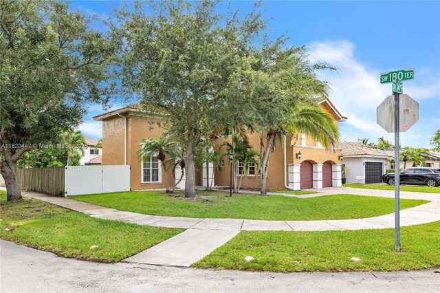 18043 SW 149th Pl, Miami, FL 33187 - view of front of property with concrete driveway, stucco siding, and a garage