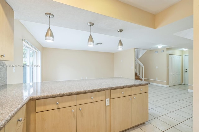 18043 SW 149th Pl, Miami, FL 33187 - kitchen with light brown cabinetry, light tile patterned flooring, and decorative light fixtures