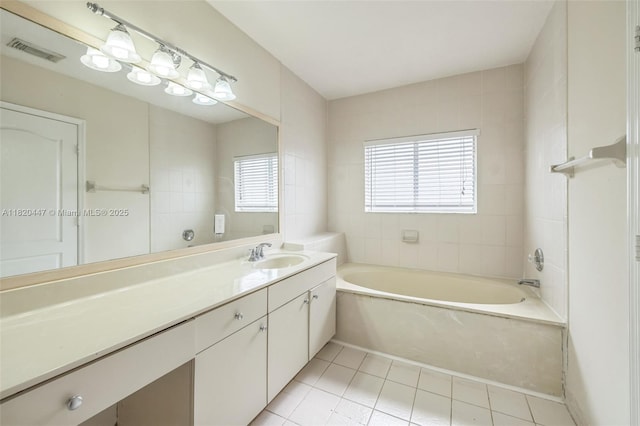 18043 SW 149th Pl, Miami, FL 33187 - bathroom with a garden tub, tile patterned flooring, and vanity