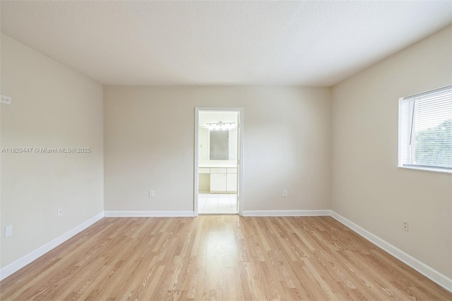18043 SW 149th Pl, Miami, FL 33187 - unfurnished room with light wood-style flooring and baseboards