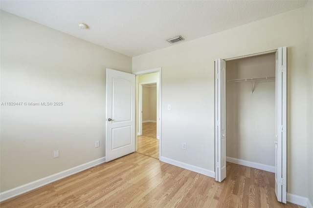 18043 SW 149th Pl, Miami, FL 33187 - unfurnished bedroom featuring light wood-type flooring and a closet