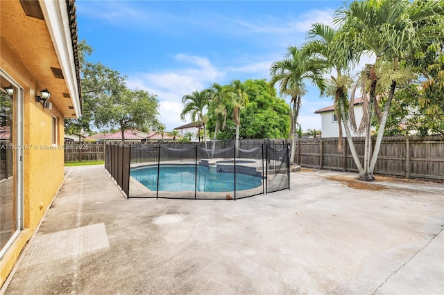18043 SW 149th Pl, Miami, FL 33187 - view of swimming pool with a fenced backyard, a patio, and a pool with connected hot tub