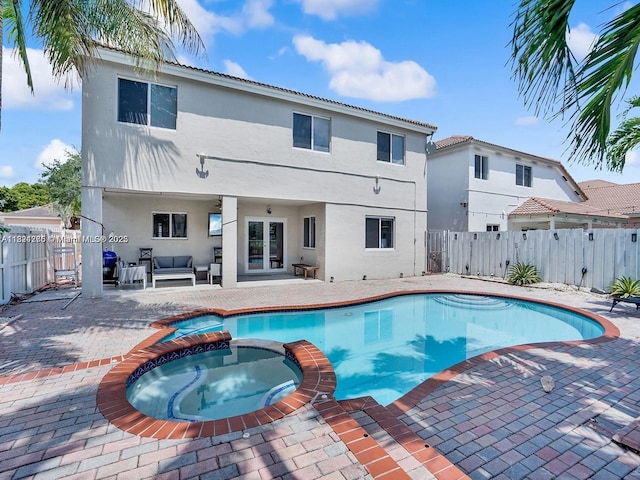 5343 NW 111th Ct, Doral, FL 33178 - view of pool with a patio area, a pool with connected hot tub, a fenced backyard, and outdoor lounge area