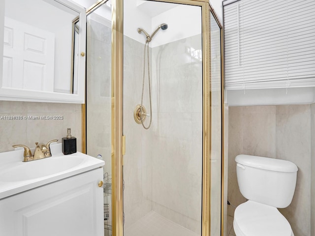 5343 NW 111th Ct, Doral, FL 33178 - bathroom featuring a shower stall, vanity, and tile walls
