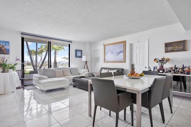 13499 Biscayne Blvd Unit 406, North Miami, FL 33181 - dining area with a textured ceiling and light tile patterned flooring