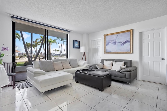 13499 Biscayne Blvd Unit 406, North Miami, FL 33181 - living area featuring light tile patterned flooring and a textured ceiling