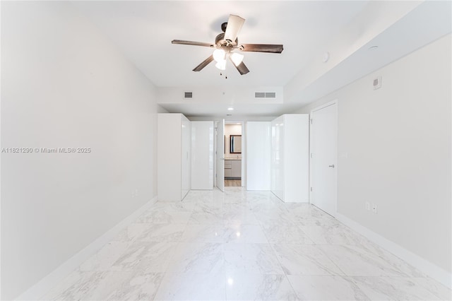 1010 Brickell Ave Unit 1409, Miami, FL 33131 - unfurnished room featuring ceiling fan, light marble finish floors, and a smoke detector