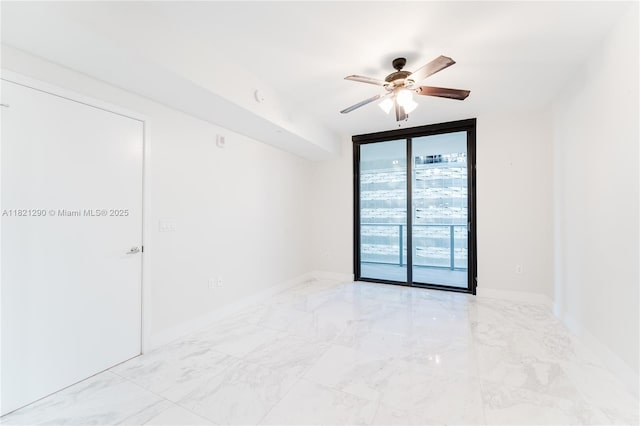 1010 Brickell Ave Unit 1409, Miami, FL 33131 - spare room with expansive windows, ceiling fan, and marble finish flooring