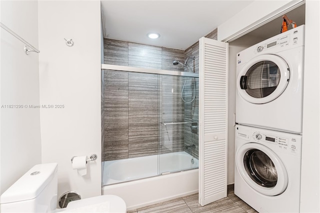 1010 Brickell Ave Unit 1409, Miami, FL 33131 - full bathroom with estacked washer and dryer and shower / bath combination with glass door