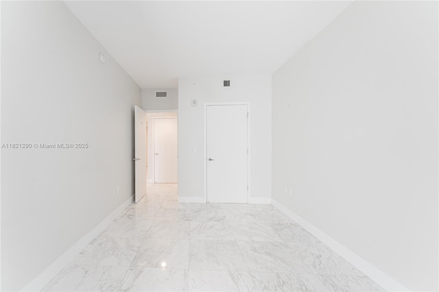 1010 Brickell Ave Unit 1409, Miami, FL 33131 - unfurnished room with light marble finish floors and baseboards