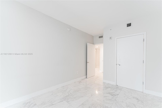 1010 Brickell Ave Unit 1409, Miami, FL 33131 - empty room featuring light marble finish flooring and baseboards