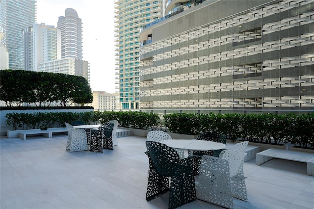 1010 Brickell Ave Unit 1409, Miami, FL 33131 - view of patio featuring outdoor dining area and a city view