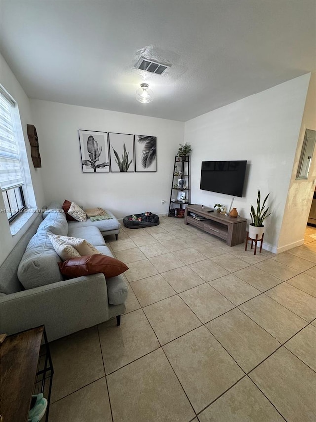581 SE 32nd Ter, Homestead, FL 33033 - living area featuring light tile patterned floors