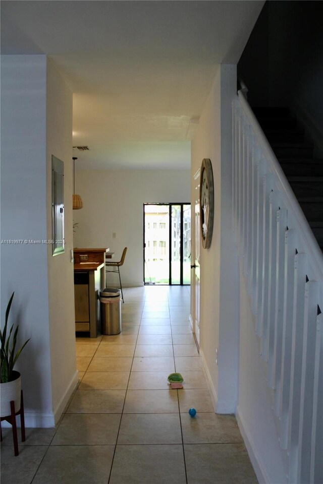 581 SE 32nd Ter, Homestead, FL 33033 - corridor featuring light tile patterned floors, electric panel, and stairway