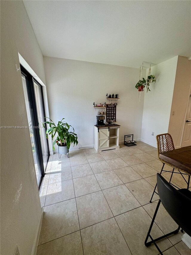 581 SE 32nd Ter, Homestead, FL 33033 - dining space with light tile patterned floors and baseboards
