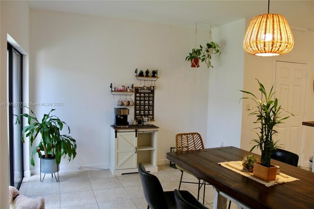 581 SE 32nd Ter, Homestead, FL 33033 - dining area with light tile patterned floors and baseboards