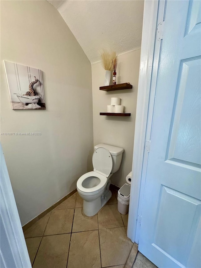 581 SE 32nd Ter, Homestead, FL 33033 - bathroom featuring vaulted ceiling and tile patterned flooring