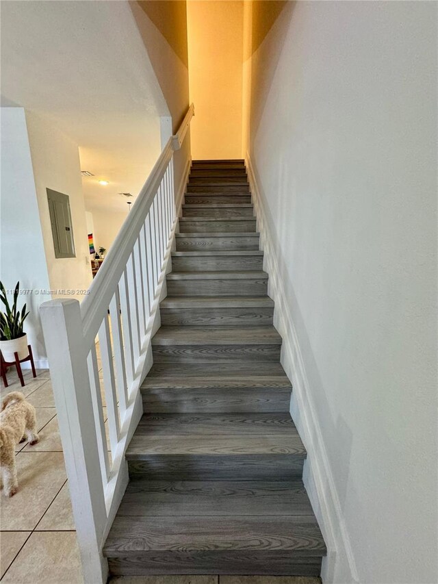 581 SE 32nd Ter, Homestead, FL 33033 - staircase featuring electric panel and tile patterned floors