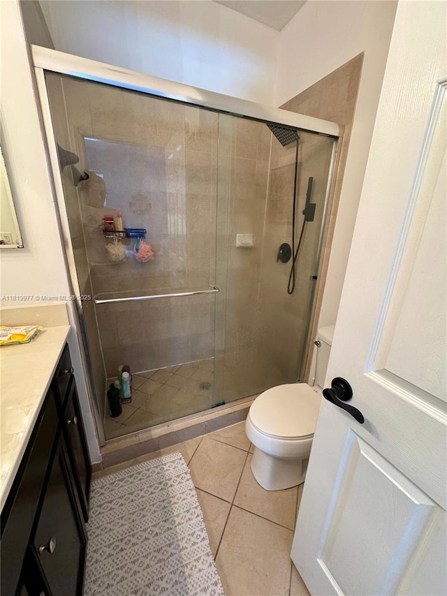 581 SE 32nd Ter, Homestead, FL 33033 - bathroom featuring vanity, a shower stall, and tile patterned floors