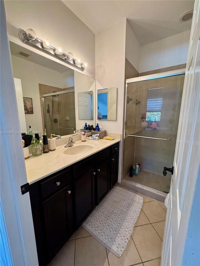 581 SE 32nd Ter, Homestead, FL 33033 - full bathroom with vanity, tile patterned flooring, and a shower stall