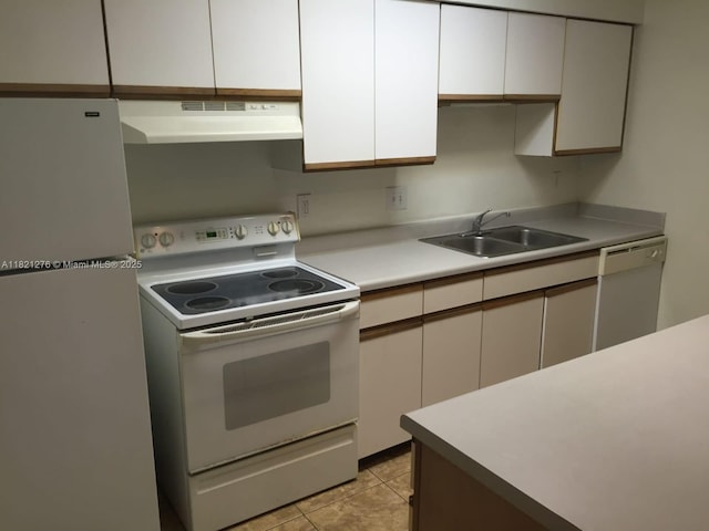 4055 W Mcnab Rd Unit H112, Pompano Beach, FL 33069 - kitchen featuring white appliances, under cabinet range hood, light countertops, white cabinets, and light tile patterned floors