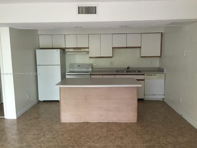 4055 W Mcnab Rd Unit H112, Pompano Beach, FL 33069 - kitchen with white appliances, extractor fan, a center island, white cabinetry, and light countertops