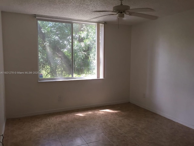 4055 W Mcnab Rd Unit H112, Pompano Beach, FL 33069 - empty room with ceiling fan, a textured ceiling, and tile patterned flooring