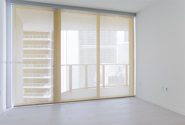 1000 Brickell Plz Unit 3703, Miami, FL 33131 - unfurnished room with wood finished floors and baseboards
