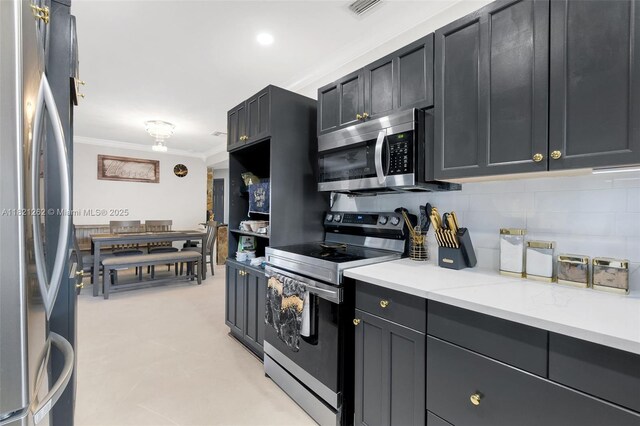 7631 Miramar Pkwy, Miramar, FL 33023 - kitchen featuring appliances with stainless steel finishes, crown molding, tasteful backsplash, and light stone counters